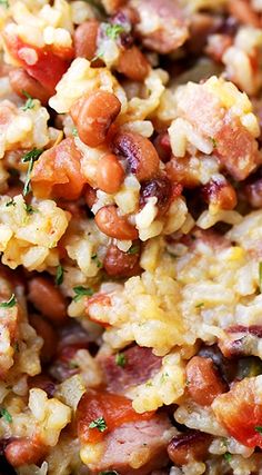 closeup of rice, beans and sausage on a plate with parsley in the middle