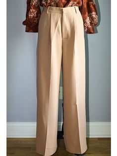 FEATURES Elegant, Classy & Chic High Waisted Wide Leg Pants The wide-leg trouser is a flattering and chic silhouette designed to flatter your shape. Adding a front pleat and pockets, these trousers have a relaxed but tailored construction. Button/zip fly closure with front button, zipper fly, and belt loops. FABRIC 78% Polyester, 18% Rayon, and 4% Spandex Imported SIZE + FIT Sizing is True to Size | Tapered Fit with minimal stretch Size Bust Waist Hip Small (2-4) 36” - 37” 27” – 28” 36” – 37 Formal Wide Leg Dress Pants, Formal Wide Leg Full Length Pants For Fall, Formal Fall Full Length Wide Leg Pants, Brown Pressed Crease Office Bottoms, Tailored Brown Wide Leg Pants For Work, Brown Ankle-length Dress Pants For Work, Formal Wide-leg Dress Pants For Fall, Formal Wide-leg Dress Pants, Tailored Beige Wide Leg Pants