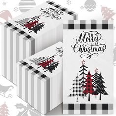 three boxes with christmas trees on them