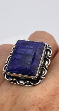 Vintage Blue Raw Sapphire Ring Boho Statement Unusual Deep Toned Sapphire White bronze NOT 925 Sterling Filigree Setting Handmade Size 7 Can be resized, my jeweler charges $20 All rings are shipped in a nice gift box. Check out our over a THOUSAND great reviews Engraving is $4 per letter and is not always perfect depending on the piece. It can take a few days if the jeweler is busy. This is payable to Paypal Judithsltd@gmail.com Blue Rectangular Faceted Jewelry, Sterling Silver Sapphire Ring Stamped 925 As Gift, Unique Sapphire Ring Stamped 925, Sapphire Ring Stamped 925 As A Gift, Sapphire Rings Stamped 925 As Gifts, Sapphire Jewelry With Large Stone For Anniversary, Silver Faceted Sapphire Ring As Gift, Silver Rectangular Sapphire Ring Gift, Faceted Silver Sapphire Ring As Gift