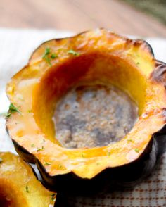 an eggplant dish is served on a plate with dipping sauce in the center