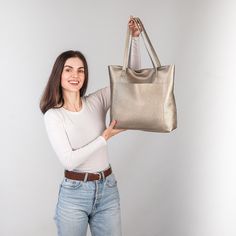 This handmade women tote bag is produced by Italian soft pebbled leather. It has one pocket inside. The bag has a high-quality zipper that secures your belongings. It holds the shape perfectly and you may be confident that your things like cell phone, tablet, lap-top are safe. This bag is simple, reliable, and durable. Its universal look allows using the tote bag for various purposes. One may take the bag to the work, shopping, meeting, or walk and feel comfortable with it in any condition. Size and Dimensions:       〰️ SMALL 〰️ Height: 12 inches (30 cm) Width (the top): 12.6 inches (32 cm) Width (the bottom): 9 inches (23 cm) Depth: 4.3 inches (11 cm)      〰️ MEDIUM 〰️ Height: 13.4 inches (34 cm) Width (the top): 14.6 inches (37 cm) Width (the bottom): 11 inches (28 cm) Depth: 4.3 inches Pebbled Leather Tote Shoulder Bag, Everyday Pebbled Leather Tote Bag, Pebbled Leather Tote Bag, Elegant Bags With Pebbled Texture For Everyday Use, Everyday Satchel With Pebbled Leather Texture, Leather Shoulder Bag With Pebbled Texture, Elegant Tote Bag With Pebbled Texture, Elegant Pebbled Texture Tote Bag, Travel Shoulder Bag With Pebbled Texture Tote