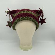 a crocheted hat on top of a mannequin head