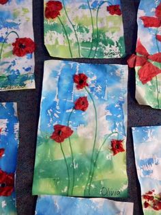 four square paintings with red flowers painted on them