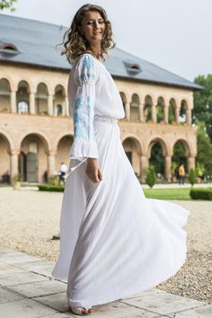 A modern easy to wear dress based on the traditional Romanian blouse named "IE". Made of 100% cotton light fabric, this is a fashionable and versatile dress, suitable for many occasions. The upper part respecting entirely the classic design used for decades by Romanian peasants is completed by a rich skirt, creating an elegant silhouette .  The seams are made using delicate cotton lace and the wide sleeves are featuring a rich, "ton-sur-ton" or turquoise embroidery. The dress is very easy to adj Cotton Day Dresses With Embroidered Hem, Cotton Daywear Dresses With Embroidered Hem, Cotton Dress With Embroidered Hem For Daywear, Folk Style Long Sleeve Dresses For Daywear, Long Sleeve Folk Dresses For Daywear, Long Sleeve Cotton Embroidered Spring Dress, Peasant Style Long Sleeve Maxi Dress For Daywear, Long Sleeve Cotton Embroidered Dress For Spring, Traditional Spring Daywear Dress