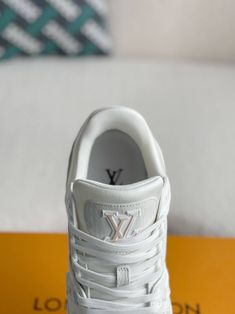 Step into luxury with these Louis Vuitton Trainer-inspired sneakers. Crafted with a premium leather upper and a contrasting suede lower, these shoes offer a refined take on the iconic silhouette. The clean white colorway and subtle Louis Vuitton branding create a timeless and versatile look, perfect for those who appreciate understated elegance. Experience the perfect blend of comfort, quality, and high-fashion appeal. Disclaimer: This product is inspired by iconic designer footwear. It is not a Louis Vuitton Trainers, Fall Winter Jacket, Denim Sneakers, Loafer Sneakers, Bottega Veneta Shoulder Bag, White Denim, Shoe Box, Loafer Shoes, Sneaker Boots