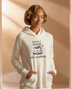 a woman wearing a white hoodie that says don't be a derby have an espresso