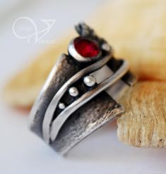 image 0 Unique Silver Ruby Birthstone Ring, Unique Silver Ruby Ring With Birthstone, Unique Open Ruby Promise Ring, Hand Forged Red Jewelry For Anniversary, Unique Ruby Promise Ring With Accent Stones, Hand Forged Ruby Ring Jewelry, Hand Forged Sterling Silver Ruby Ring, Unique Silver Ruby Promise Ring, Unique Silver Ruby Ring With Stone Setting