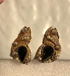 "Pretty pair of Florenza earrings. They have an Etruscan style design, gold tone, seed pearls and black onyx.  They measure 1.25\" x 5/8\". They are in excellent condition." Victorian Jeweled Earrings For Formal Occasions, Evening Jeweled Costume Jewelry Earrings, Evening Costume Jewelry Earrings, Ornate Jeweled Earrings For Formal Occasion, Evening Jeweled Costume Earrings, Black Pearl Drop Earrings For Evening, Formal Jeweled Costume Jewelry Earrings, Formal Costume Jewelry Earrings With Jewels, Antique Black Earrings For Formal Occasions