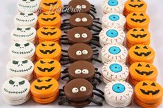 halloween themed cupcakes are arranged in rows