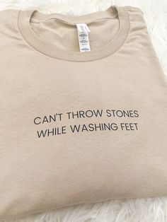 Can't Throw Stones While Washing Feet - Unisex T-shirt Can’t Throw Stones, Can’t Throw Stones While Washing Feet Quote, Stretch Slogan T-shirt With Short Sleeves, Stretch Slogan T-shirt Short Sleeve, Cotton Stretch T-shirt With Text Print, Stretch Crew Neck T-shirt With Text Print, Funny Text Stretch Short Sleeve T-shirt, Stretch Cotton T-shirt With Funny Text, Cotton Stretch T-shirt With Funny Text