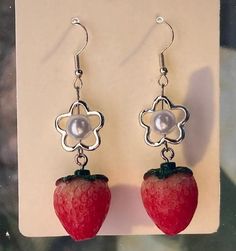 These cute strawberry charm earrings come with silver (coloured) earring hooks, flower and pearl beads and an adorable resin strawberry charm! Perfect as a summery accessory or gift, they are designed and made by me, for you! Cute Fruit Design Dangle Jewelry, Cute Dangle Earrings With Fruit Design, Strawberry Charm, Cute Strawberry, Etsy Earrings Dangle, Charm Earrings, Pearl Beads, Jewelry Earrings Dangle, Dangle Drop Earrings