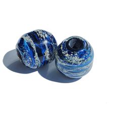 Celebrate the memory of your loved ones with our exquisite Remembrance Beads, thoughtfully crafted from high-quality borosilicate glass. Each ash bead is a unique work of art, available in a variety of beautiful colors. The process begins with laying out the chosen color, followed by carefully mixing the ashes with clear glass. The bead is then sealed in clear glass, ensuring it is completely waterproof and securely encases the ashes. Our Remembrance Beads measure approximately 5/8 of an inch ro Recycled Glass Round Beads Jewelry For Gifts, Recycled Glass Round Beads Jewelry Gift, Recycled Glass Gemstone Beads Jewelry For Gifts, Recycled Glass Gemstone Beads Jewelry Gift, Recycled Glass Jewelry With Spacer Beads As Gift, Recycled Glass Spacer Beads Jewelry As Gift, Gift Recycled Glass Beads, Gift Recycled Glass Round Beads, Spiritual Recycled Glass Beads For Gifts