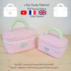 two pink and white checkered lunchboxs sitting on top of a wooden table