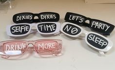 six pairs of glasses with words on them that say, dixes dimes selfie time no sleep