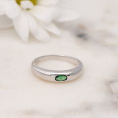 Elegant dome ring with a minimalist emerald center stone is the perfect statement piece. It's dainty and pairs well with other rings. D E T A I L S ▫︎ Made of High Quality 925 Sterling Silver ▫︎ Finish: Thick Plating of 14k Gold or Rhodium ▫︎ Dimensions: 4.5 mm in Height ▫︎ Available in Sizes 4 - 10 ▫︎ Made with the highest grade of cubic zirconia stone for an authentic look ▫︎ Also available in White CZ center stone https://www.etsy.com/listing/876281908/minimalist-dome-ring-gold-ring-chunky?ga Elegant Round Emerald Dome Ring, Modern Green Round Dome Ring, Classic Gemstone Dome Ring, Elegant Emerald Dome Ring, Classic Green 14k Gold Dome Ring, Layering Diamond Necklaces, Opal Stacking Ring, Sterling Silver Opal Ring, Silver Opal Ring