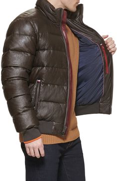 Stay warm in this water-resistant faux-leather bomber jacket constructed with channel-quilted panels, secure zip pockets and stretchy ribbed trim. 26 1/2" length Front zip closure Stand collar Front zip pockets; interior zip pocket Lined, with 100% polyester fill 100% polyurethane Machine wash, tumble dry Imported Brown Leather Jacket With Zipper For Cold Weather, Leather Puffer Jacket With Zipper For Fall, Casual Leather Puffer Jacket For Cold Weather, Fall Leather Puffer Jacket With Zipper, Brown Quilted Leather Jacket For Winter, Casual Fitted Quilted Leather Jacket, Fitted Quilted Leather Jacket In Casual Style, Quilted Long Sleeve Leather Jacket For Cold Weather, Quilted Leather Jacket For Cold Weather