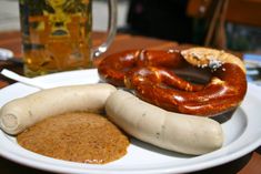 two sausages and some other food on a plate