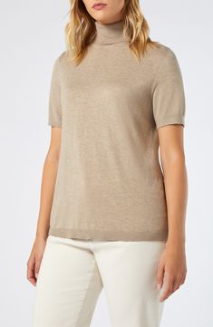 Enjoy the warmth and sophistication of this short-sleeve turtleneck sweater elevated in a luxe cashmere-kissed blend. Turtleneck Short sleeves 65% viscose, 32% polyamide, 3% cashmere Hand wash, dry flat Imported Elegant Knit Top With Funnel Neck, Cashmere Turtleneck Top With Relaxed Fit, Relaxed Fit Turtleneck Cashmere Top, Relaxed Fit Cashmere Turtleneck Top, Classic Stretch Cashmere Tops, Fine Knit T-shirt For Workwear, Elegant Fine Knit Short Sleeve T-shirt, Elegant Stretch Cashmere Top, Fitted Short Sleeve Cashmere Tops