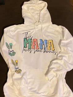 This Mama Loves Her Bunnies Hoodie | Mother Easter Hoodie | Easter Bunny Customized Sweatshirt Hoodie Unisex White super soft hoodie, unisex All Sales Are Final. Please use size chart. Casual Hoodie Tops With Custom Print, Fun Long Sleeve Cotton Hoodie, Fun Cotton Hoodie Sweatshirt, Fun Hoodie With Letter Print, Fun White Hoodie For Fall, White Fun Winter Hoodie, Casual Long Sleeve Hoodie With Custom Print, Spring Fun Hoodie Sweatshirt, White Custom Print Hoodie For Fall