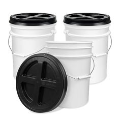 three white buckets with black lids are shown