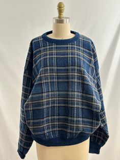 This 90s vintage sweater is one of my favorites. In a blue, white, black, gray plaid design,  it also has a round collar, with a great fit. Wear with an ankle length denim a black boot or gray joggers and sneakers for a cool street style vibe. -Vintage 90s -Minimalist plaid design -Machine wash recommended Measurements: marked a mens large *Sleeve 21  inches *Bust 25 inches *Length 25 inches *Bottom opening 16 inches  *Please note this item is pre loved and there may be minor flaws to the garment. Not to worry if there is anything major we will let you know. --Returns will not be accepted. I encourage you to ask questions for additional pictures, measurements, etc.-- Vintage Sweaters Men, Casual Plaid Crew Neck Sweater, Oversized Plaid Casual Sweater, Casual Oversized Plaid Sweater, Cotton Plaid-patterned Winter Sweater, Oversized Plaid Sweater For Winter, Vintage Sweaters 90s, Cool Street Style, Vibe Vintage