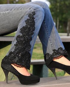 a woman's legs wearing high heels with black lace and flowers on the side