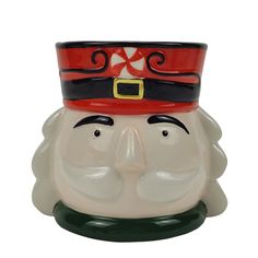 a close up of a ceramic santa clause head