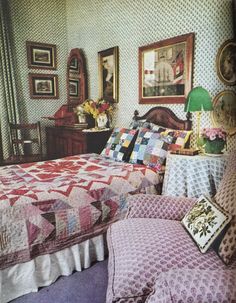 a bed room with a neatly made bed and pictures on the wall next to it