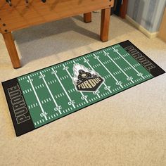 Always be at the field with Sports Licensing Solutions Football Field Runner Mat. With the same design as your favorite teams actual field you can always be with your team even at home. At 30 inches tall by 72 inches long this mat is perfect for any game room, man cave, or next to your bed. The carpet is a soft nylon so that is can hold up against moderate to high foot traffic. To make sure that the mat last for years we have used vinyl for the backing and then serged the edges of the mat. Made Colorado Buffaloes Football, Game Room Man Cave, Buffalo Football, Purdue Boilermakers, Colorado Buffaloes, Nylon Carpet, Purdue University, Military Academy, University Of Colorado