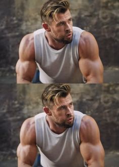 a man in grey tank top doing exercises