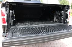 the back end of a truck with its cargo compartment open