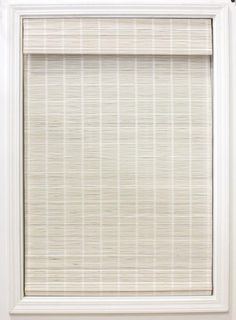 a white window with a vertical blind in front of it