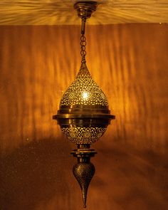 a lamp hanging from the ceiling in a room