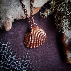 A real ocean shell plated in copper.  Electroformed copper necklace made with scavenged ocean treasures.  Handcrafted jewelry. Mermaid, boho, sea witch style. Handmade Copper Jewelry For The Beach, Handmade Copper Jewelry For Beach, Handmade Copper Necklace For The Beach, Siren Character, Witchy Whimsical, Spiritual Gold Electroformed Jewelry, Symbolic Electroformed Gold Jewelry, Gold Shell Necklace Ocean-inspired, Bohemian Electroformed Rose Gold Necklace