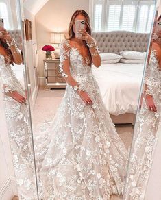 a woman taking a selfie in her wedding dress while standing in front of a mirror