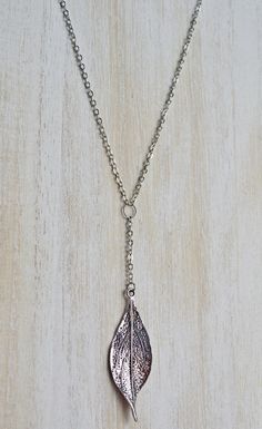 This is a 24-inch necklace with a pewter arrow pendant. The pendant measures 2 inches by 5/8 inch. Nature-inspired Sterling Silver Pendant Jewelry, Adjustable Silver Arrowhead Necklace, Silver Leaf-shaped Necklace Gift, Silver Adjustable Arrowhead Necklace, Silver Leaf-shaped Sterling Silver Necklace, Elegant Sterling Silver Leaf-shaped Necklace, Bohemian Silver Arrowhead Necklace, Silver Leaf-shaped Nature-inspired Necklace, Silver Maple Leaf