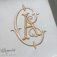 an embroidered monogram with the letter a in it