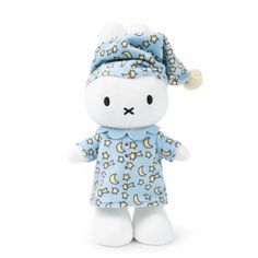 a white stuffed animal wearing a blue dress and hat with stars on it's head