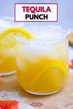 two glasses filled with lemonade and garnished with ice