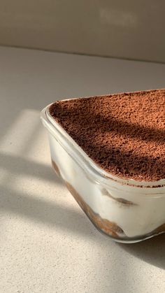 a bowl filled with chocolate cake sitting on top of a counter