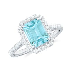 Product Details Make a statement with this Emerald Cut Shape Sky Blue Topaz Classic Engagement Ring, adorned with a Diamond Halo. The ring features a stunning Emerald Cut-cut Sky Blue Topaz set in a prong setting, surrounded by a dazzling halo of Diamond stones that adds to its luxurious appeal. The Sky Blue Topaz is known for its calming and soothing energy, making it a perfect symbol of love and serenity. The classic design of this engagement ring exudes sophistication and elegance, making it a timeless piece that will be cherished for years to come. This ring is a perfect choice for any bride-to-be who wants a unique and captivating engagement ring. Product Information SKU SHP-RINGS0821199404 Width 5.7 mm Height 11.4 mm Weight 2.21 gm (Approximate) SKY BLUE TOPAZ INFORMATION No.of Stone Classic Engagement, Topaz Engagement Ring, Halo Setting, Classic Engagement Rings, Sky Blue Topaz, 18k Yellow Gold Ring, Diamond Halo, Diamond Stone, Yellow Gold Rings