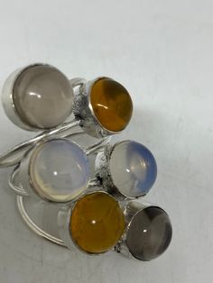 Vintage genuine Citrine, Topaz, Moonstone Silver Adjustable Cocktail ring Size 7-11 genuine citrine Low content silver not sterling. All rings are shipped free in the US in a nice gift box. Check out our over a THOUSAND great reviews Engraving is $4 per letter and is not always perfect depending on the piece. It can take a few days if the jeweler is busy. This is payable to Paypal Judithsltd@gmail.com Silver Multi-stone Moonstone Ring As Gift, Silver Topaz Ring With Natural Stones As Gift, Round Citrine Gemstone, Natural Topaz Ring Gift, Heart Locket, Red Garnet, 7 11, Cocktail Ring, Cocktail Rings