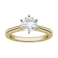 a yellow gold engagement ring with a single diamond