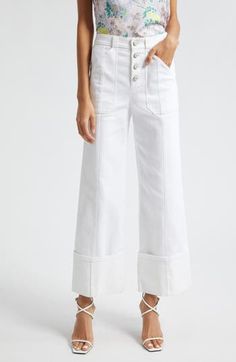 Hit refresh for white-jeans season with this wide-legged pair cut to a very cuffable length for extra trend-right style points. 28 1/2" inseam; 20 1/2" leg opening; 11" front rise; 15 1/2" back rise (size 8) Exposed-button fly Front patch pockets; back patch pockets 75% cotton, 25% polyester, 1% elastane Dry clean or machine wash, tumble dry Imported White Cropped Flare Jeans For Summer, White Relaxed Fit Cropped Flare Jeans, White Cropped Leg Flare Jeans, White Cropped Leg Pants For Fall, White Relaxed Fit Flare Jeans With Pockets, White High Waist Relaxed Fit Flare Jeans, White Relaxed Fit Flare Jeans For Spring, White Cropped Leg Flare Jeans For Fall, White Cropped Flare Jeans For Fall