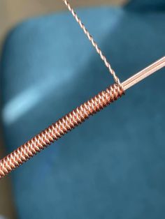 a close up of a metal object with some wires attached to it's end