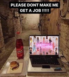 an open laptop computer sitting on top of a table next to a hamburger and soda