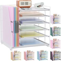 an assortment of office supplies including file folders, binder holders and alarm clock