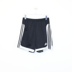 SKU - BD3440 Vintage Adidas shorts in black and white. Best fits M DETAILS: ▫️ Front logo ▫️ Drawstrings   👕 Fits like a ~ M ▫️ Label states ~  ▫️ Waist ~ 28" ▫️ Inside length ~ 7.5"  ▫️ Outside length ~ 17" Waist measurement is taken without stretching.   👇 If any defect is found and it is not included in the provided photos, it will be listed below. ▫️     🧺 All items are professionally washed and ironed before photos are taken and then sold.    ✅ If the item is listed, it is available    ❌ Adidas Logo Shorts For Streetwear, Adidas Logo Streetwear Shorts, Adidas Logo Short Bottoms For Summer, Adidas Logo Shorts For Summer, Adidas Summer Shorts With Logo, Adidas Logo Summer Shorts, Black Adidas Logo Shorts For Summer, Black Adidas Logo Summer Shorts, Casual Black Athletic Shorts With Three Stripes