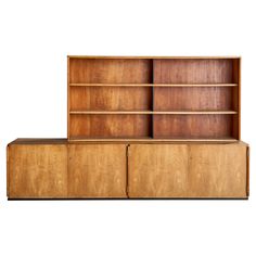 two wooden bookshelves sitting next to each other on top of a white background